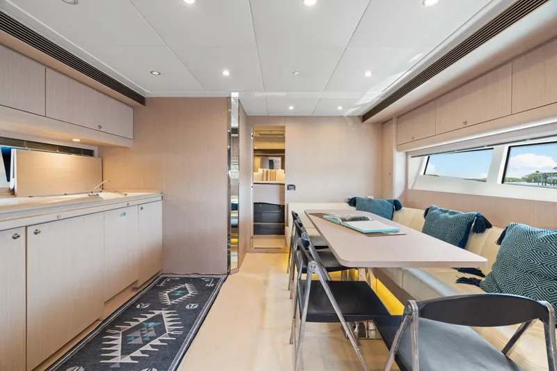 Slide: The Image of Luxurious interior of 2015 Riva 63 Virtus yacht with modern dining area and sleek design. - 23