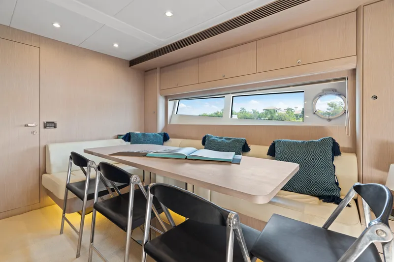 Slide: The Image of Luxurious interior of 2015 Riva 63 Virtus yacht with modern dining area and seating. - 25