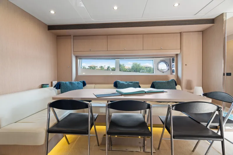 Slide: The Image of Luxurious interior of 2015 Riva 63 Virtus yacht with modern dining area. - 26