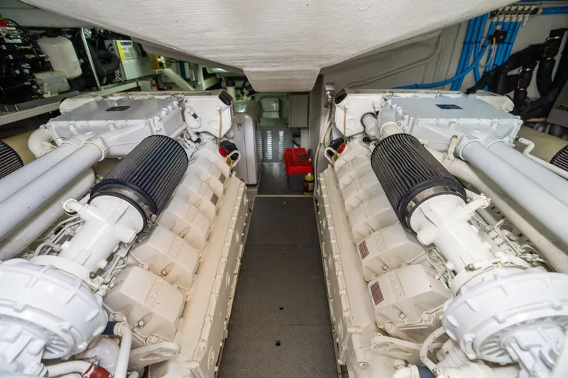 Slide: The Image of Engine room of 2015 Riva 63 Virtus yacht, showcasing dual engines and mechanical components. - 42