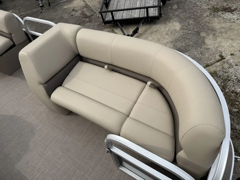 Slide: The Image of 2025 Sun Tracker Party Barge 18 DLX, beige seating, outdoor setting, pontoon boat interior. - 5