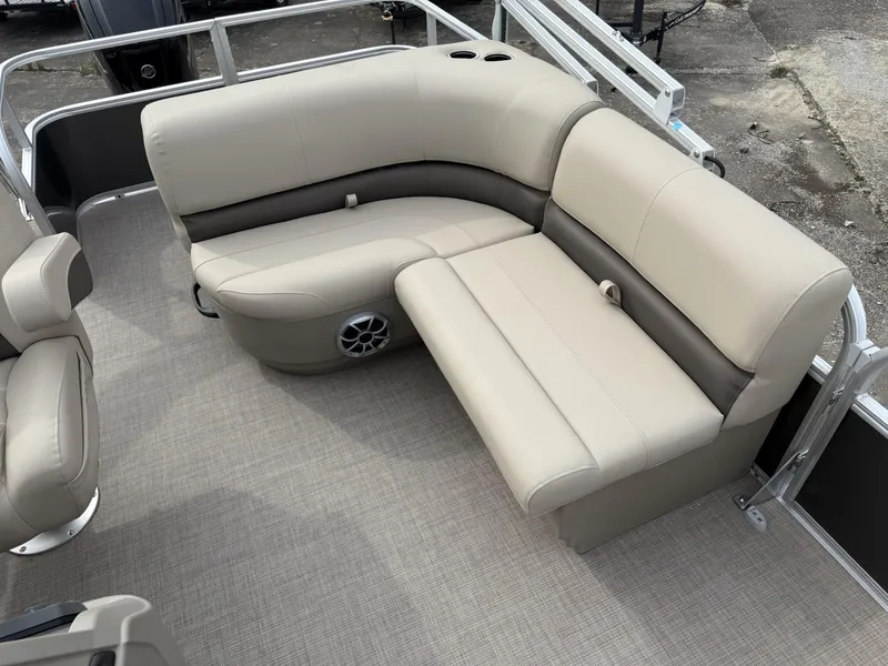 Slide: The Image of 2025 Sun Tracker Party Barge 18 DLX pontoon boat seating area with beige upholstery. - 6