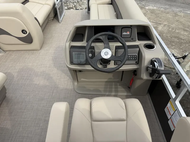 Slide: The Image of 2025 Sun Tracker Party Barge 18 DLX interior with steering console and seating. - 8