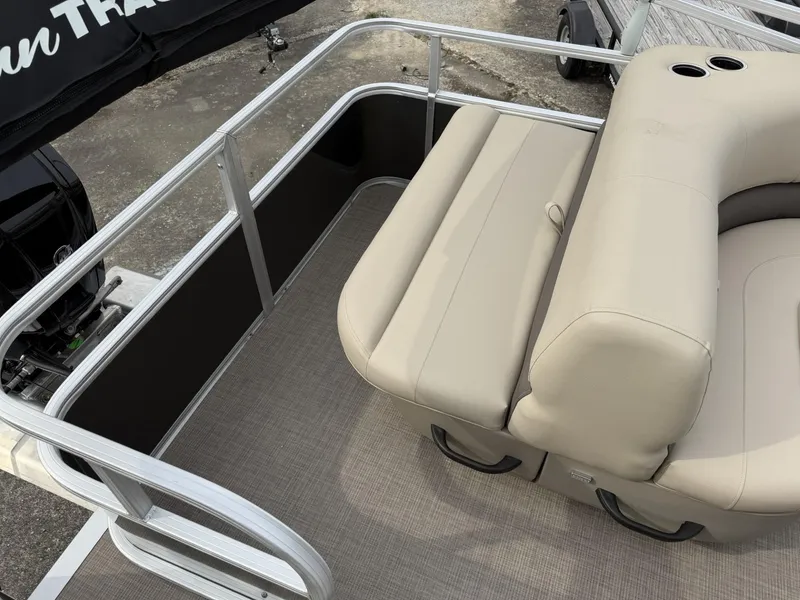 Slide: The Image of 2025 Sun Tracker Party Barge 18 DLX, beige seating, spacious deck, modern design. - 9