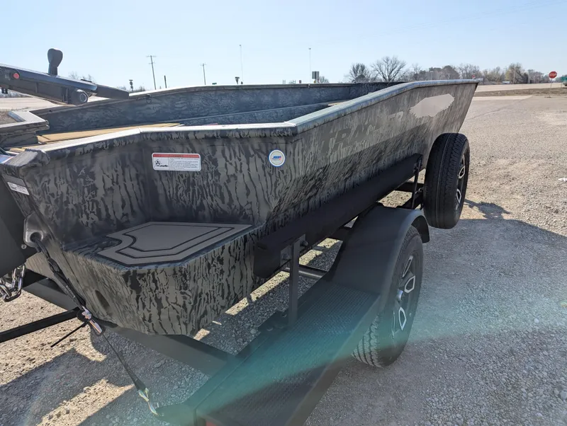 Slide: The Image of 2025 Tracker Grizzly 1650 T Prairie Wings Edition boat on a trailer, camo design. - 5