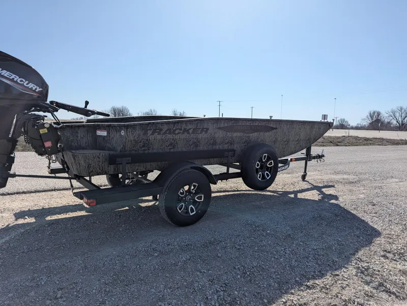 Slide: The Image of 2025 Tracker Grizzly 1650 T Prairie Wings Edition boat on trailer, outdoor setting. - 6