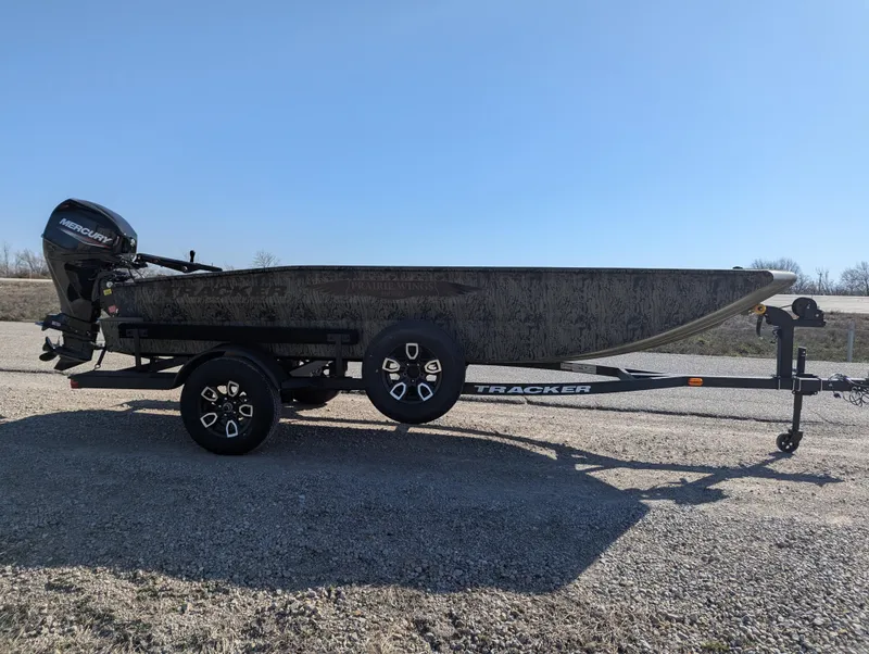 Slide: The Image of 2025 Tracker Grizzly 1650 T Prairie Wings Edition boat on trailer, side view. - 7