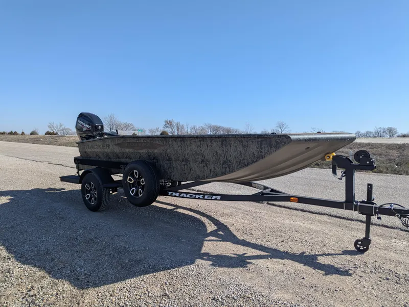 Slide: The Image of 2025 Tracker Grizzly 1650 T Prairie Wings Edition boat on trailer, outdoors. - 8