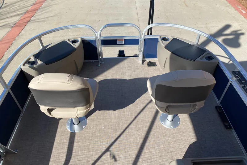 Slide: The Image of 2025 Sun Tracker Bass Buggy 18 DLX pontoon boat interior with two swivel seats. - 3