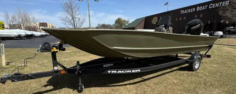 Slide: The Image of 2025 Tracker Grizzly 2072 CC boat on trailer at Tracker Boat Center. - 2