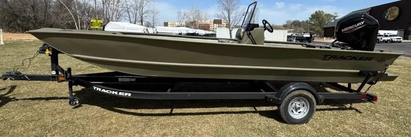 Slide: The Image of 2025 Tracker Grizzly 2072 CC boat on trailer, parked on grass. - 3