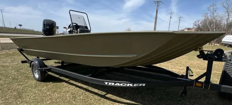 Slide: The Image of 2025 Tracker Grizzly 2072 CC boat on trailer, parked on grass. - 4