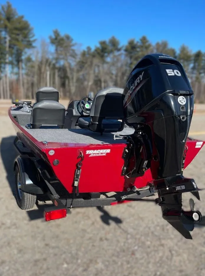 Slide: The Image of 2025 Tracker Bass Tracker Classic XL boat with Mercury 50 engine, parked outdoors. - 3