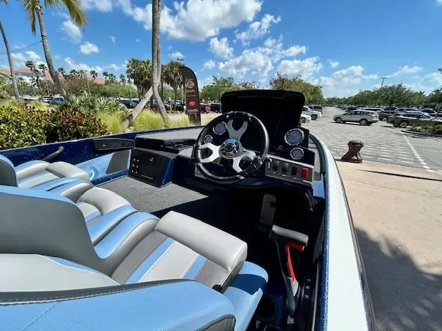 Slide: The Image of Interior of a 2025 Nitro Z18 Pro boat with blue and gray seating. - 4