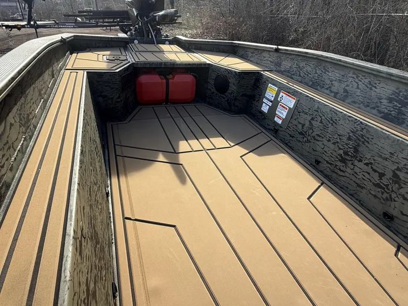 Slide: The Image of 2025 Tracker Grizzly 1650 T Prairie Wings Edition boat interior with camo design and storage space. - 11