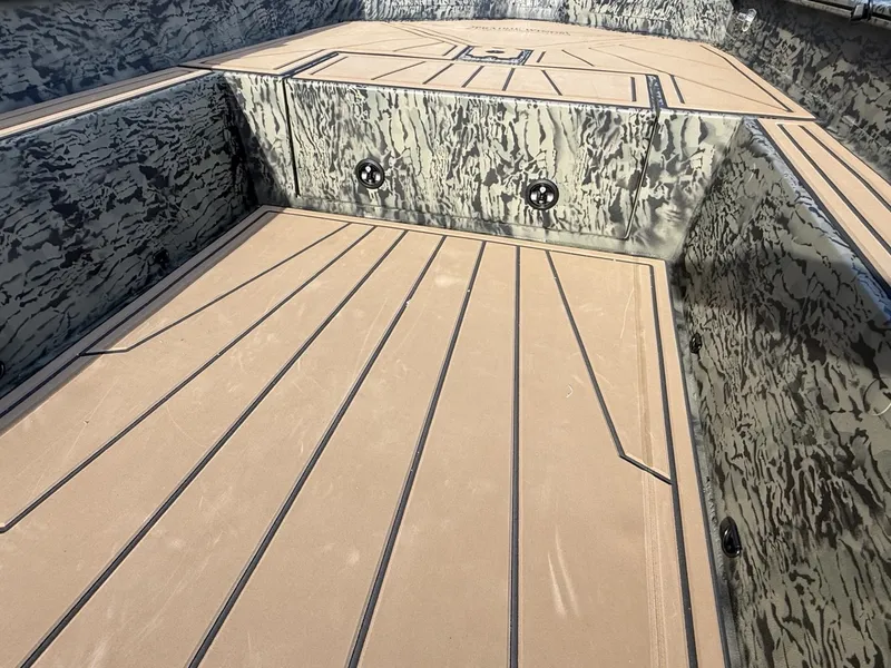 Slide: The Image of 2025 Tracker Grizzly 1650 T Prairie Wings Edition boat interior with camouflage design. - 12