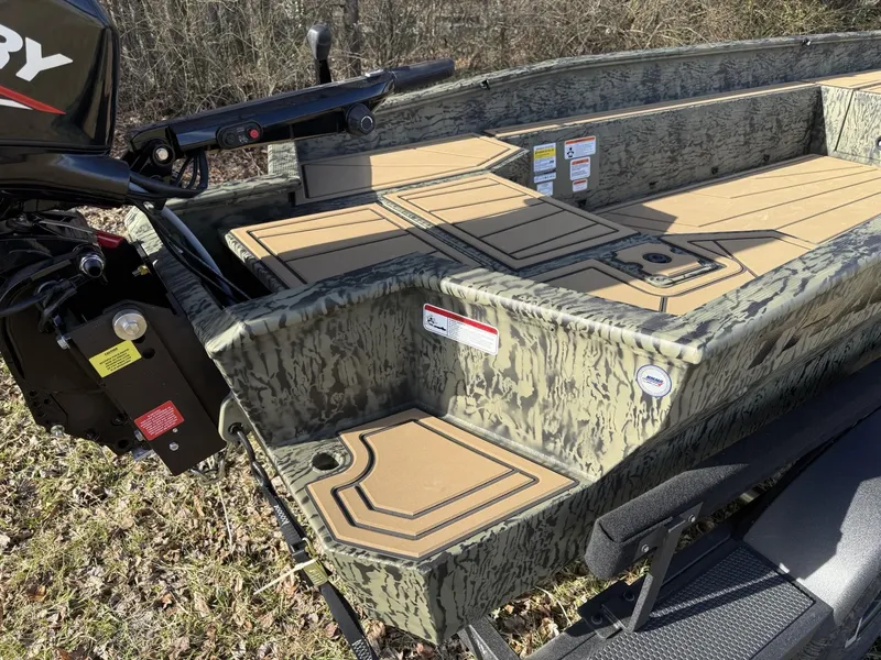 Slide: The Image of 2025 Tracker Grizzly 1650 T Prairie Wings Edition boat with camo design and Mercury outboard motor. - 4