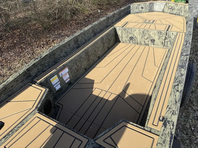 Slide: The Image of 2025 Tracker Grizzly 1650 T Prairie Wings Edition boat interior with camouflage design. - 6