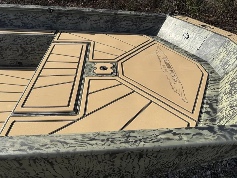 Slide: The Image of 2025 Tracker Grizzly 1650 T Prairie Wings Edition boat interior with camouflage design. - 8