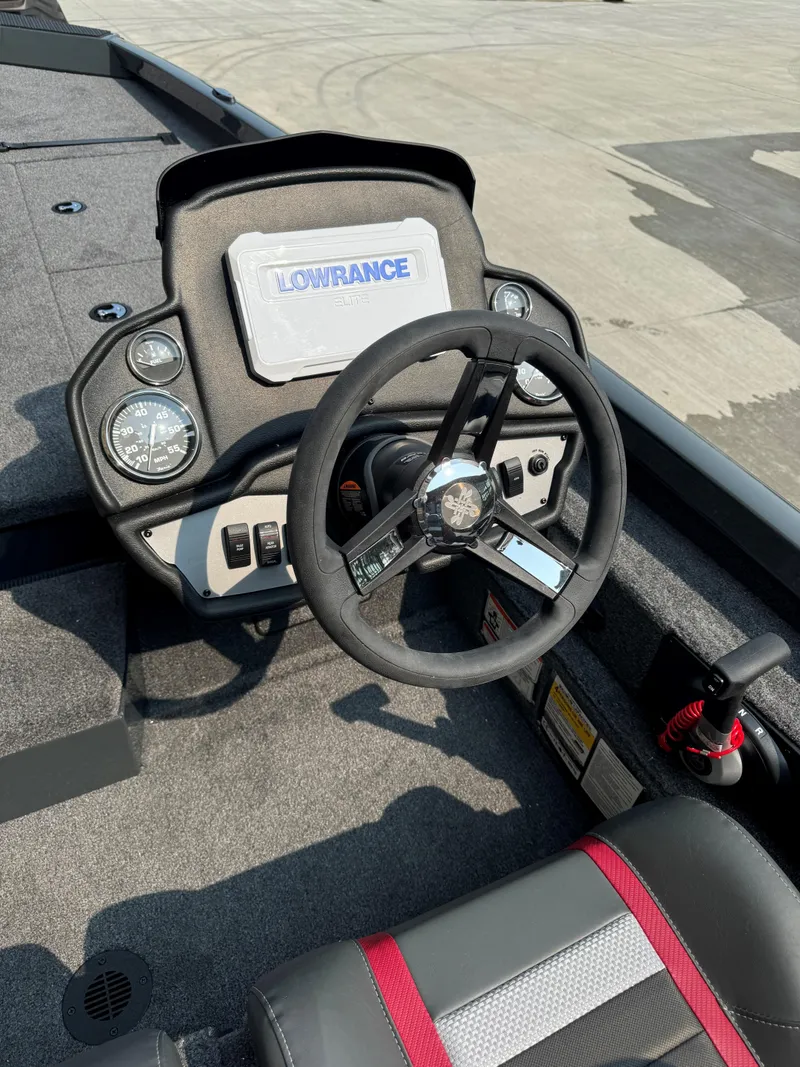Slide: The Image of 2025 Ranger RT198P boat dashboard with steering wheel and Lowrance display. - 3