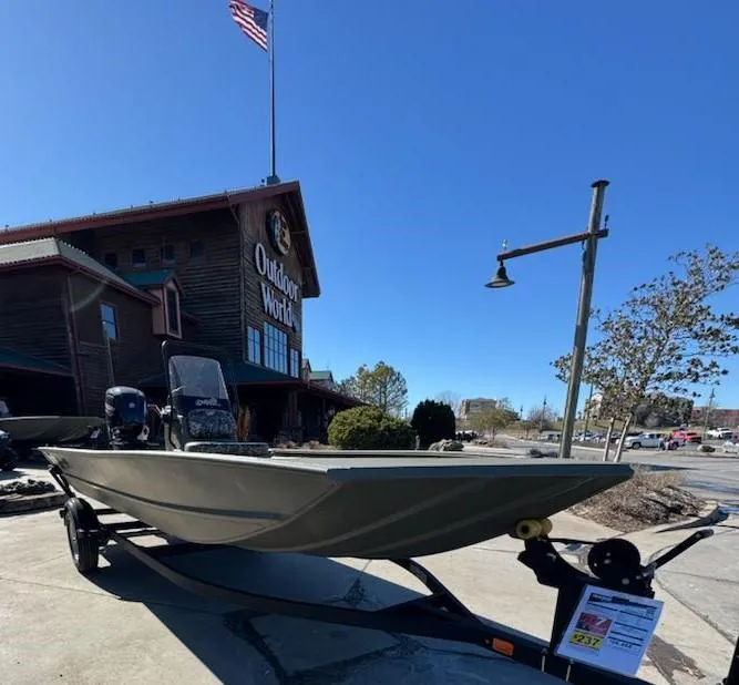 Slide: The Image of 2025 Tracker Grizzly 1860 CC boat displayed outside Outdoor World store. - 3
