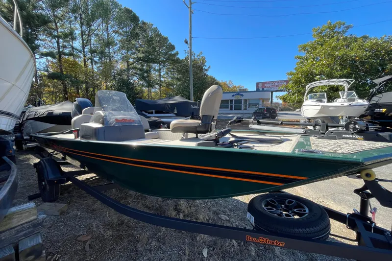 Slide: The Image of 2025 Tracker Bass Tracker Classic Limited boat on trailer, parked outdoors. - 39