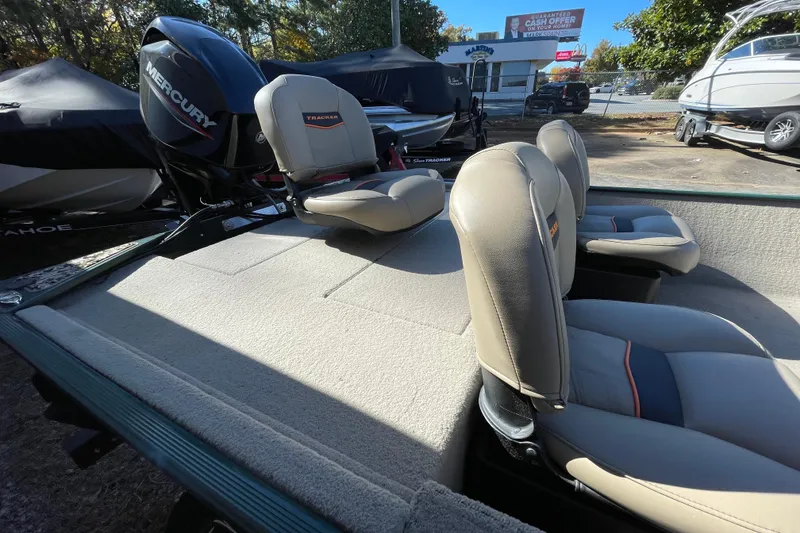 Slide: The Image of 2025 Tracker Bass Tracker Classic Limited boat with Mercury engine and comfortable seating. - 46