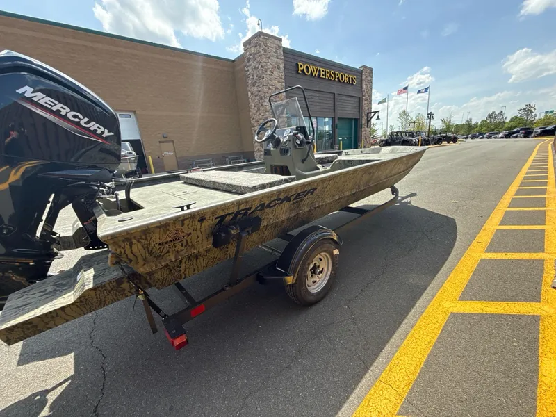 The Image of 2025 Tracker Grizzly 1860 CC boat on trailer outside Powersports store. - 0