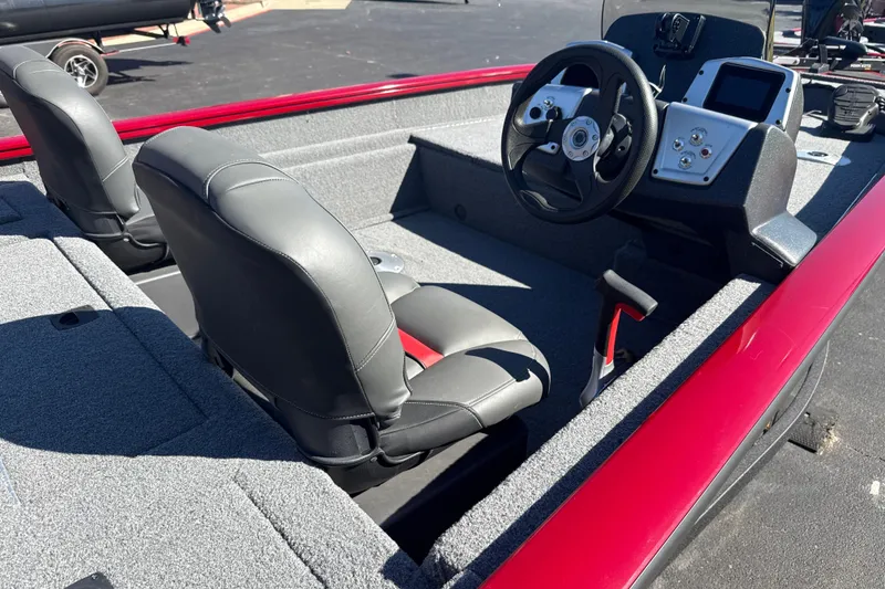 Slide: The Image of 2025 Tracker Pro Team 175 Crappie Edition boat interior with steering console and seats. - 5