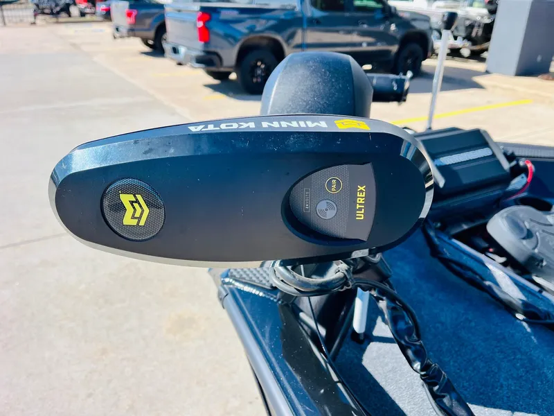 Slide: The Image of 2024 Ranger RT198P boat with Minn Kota Ultrex trolling motor, parked outdoors. - 11