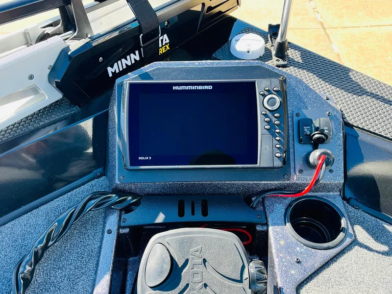 Slide: The Image of 2024 Ranger RT198P boat dashboard with Humminbird Helix 9 fishfinder and Minn Kota trolling motor. - 13