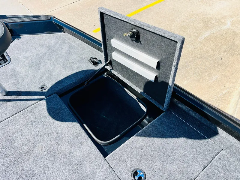 Slide: The Image of 2024 Ranger RT198P boat storage compartment open on deck. - 19