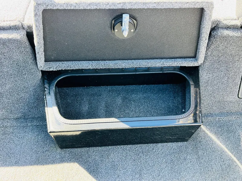 Slide: The Image of 2024 Ranger RT198P storage compartment with open lid, showcasing interior space. - 24