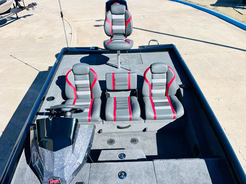 Slide: The Image of 2024 Ranger RT198P boat interior with gray and red seating, steering console, and spacious deck. - 25