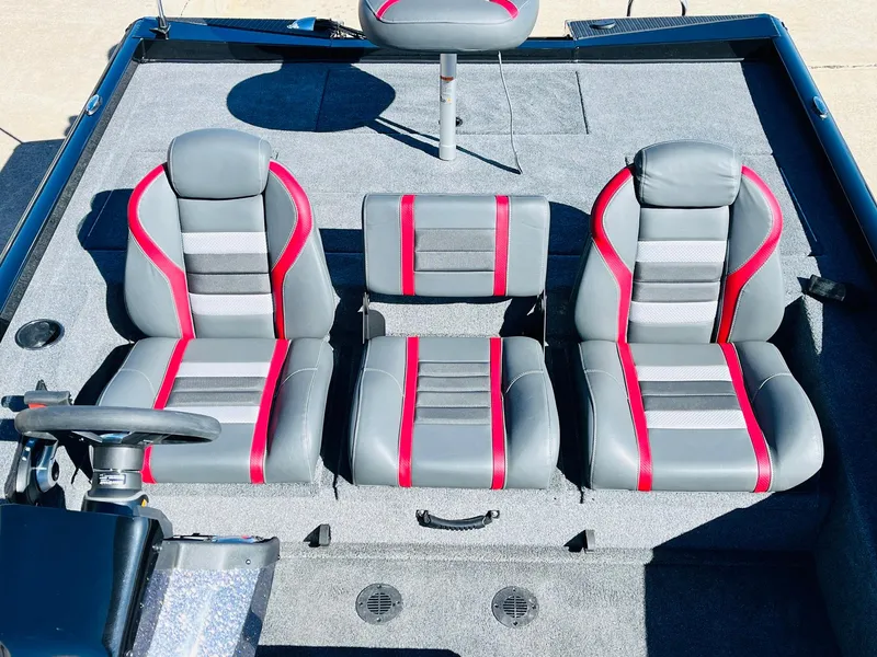 Slide: The Image of 2024 Ranger RT198P boat interior with gray and red seating arrangement. - 26