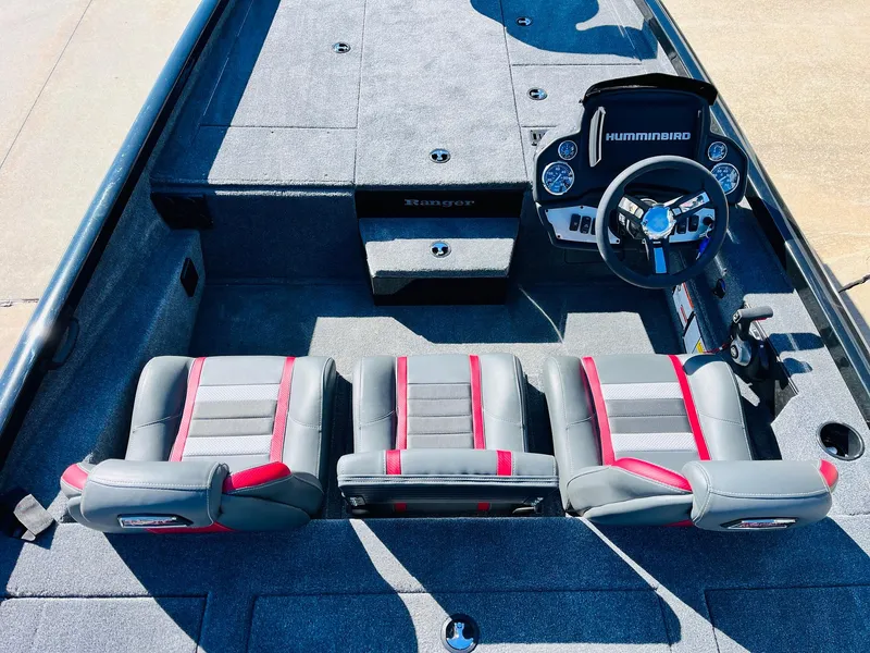 Slide: The Image of 2024 Ranger RT198P boat interior with three seats and a Humminbird dashboard. - 27