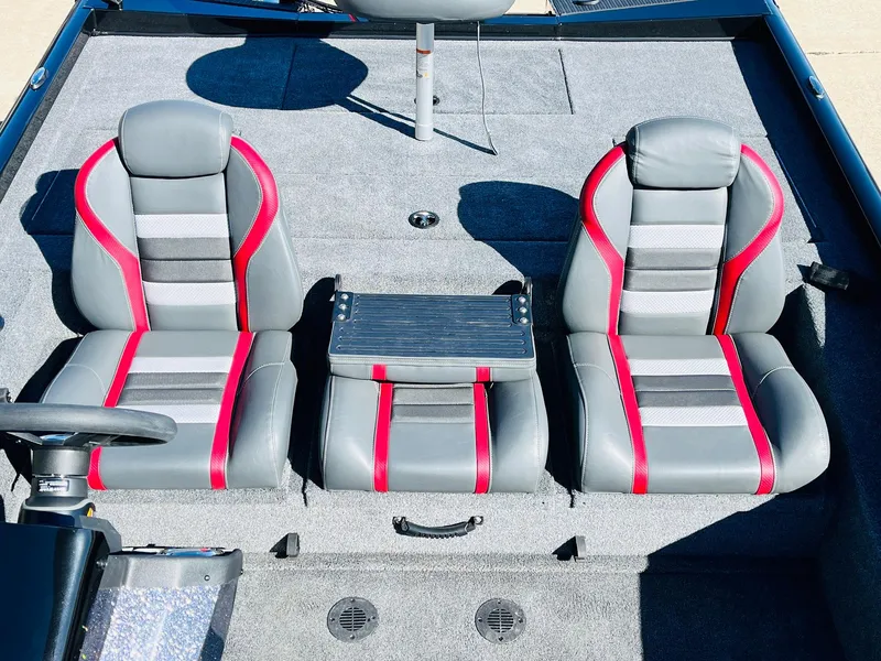 Slide: The Image of 2024 Ranger RT198P boat interior with gray and red seats. - 28