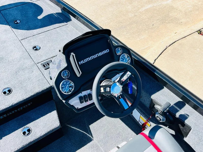 Slide: The Image of 2024 Ranger RT198P boat dashboard with Humminbird electronics and steering wheel. - 29