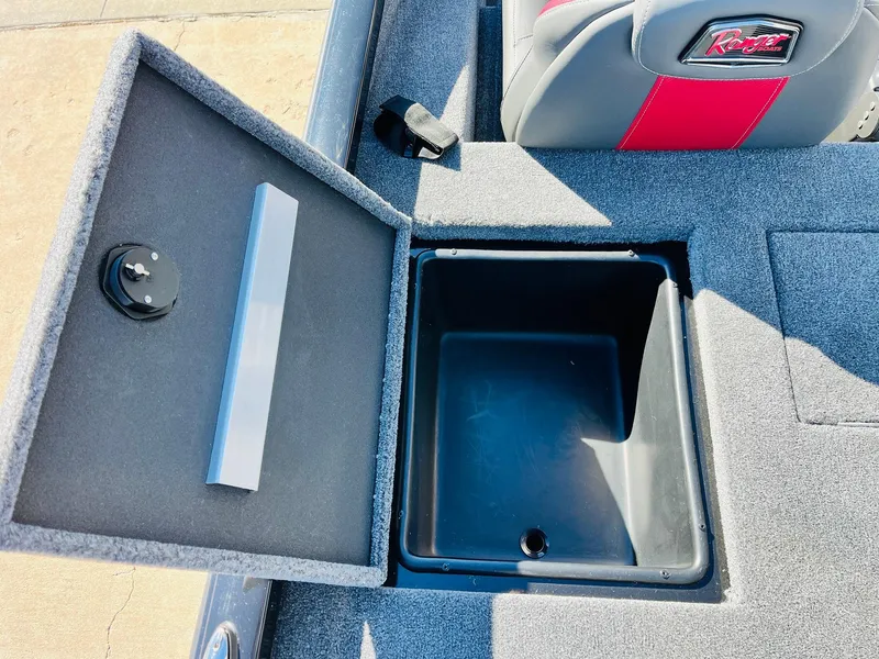 Slide: The Image of 2024 Ranger RT198P boat storage compartment with open lid, showcasing interior space. - 38