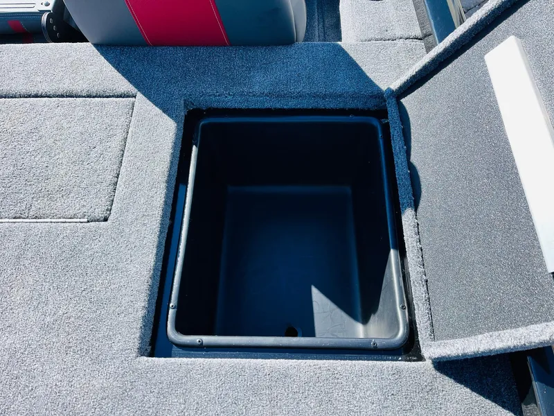 Slide: The Image of 2024 Ranger RT198P boat storage compartment with open lid, showcasing interior space. - 41