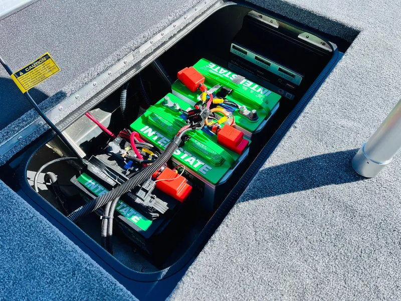 Slide: The Image of 2024 Ranger RT198P boat battery compartment with Interstate batteries and wiring. - 42