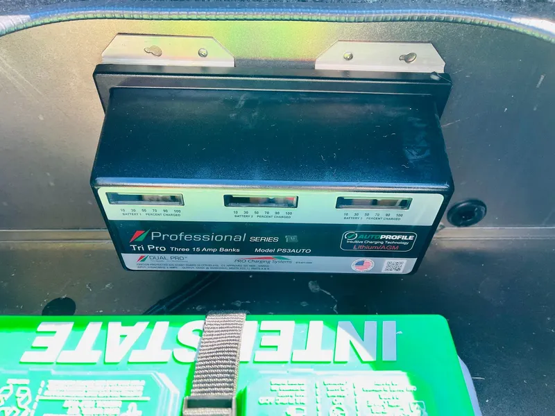 Slide: The Image of 2024 Ranger RT198P battery compartment with Professional Series Tri Pro charger. - 43