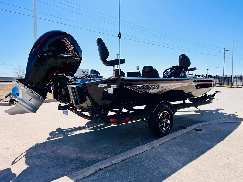 Slide: The Image of 2024 Ranger RT198P boat with powerful outboard motor on a sunny day. - 5