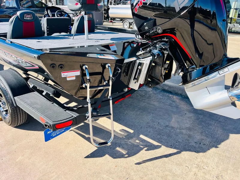 Slide: The Image of 2024 Ranger RT198P boat with powerful outboard motor and rear ladder on trailer. - 8