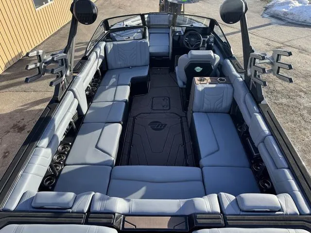Slide: The Image of 2025 Malibu 25 LSV boat interior with spacious seating and modern design. - 10