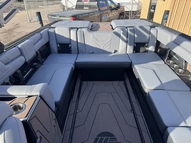 Slide: The Image of 2025 Malibu 25 LSV boat interior with spacious seating and modern design. - 13