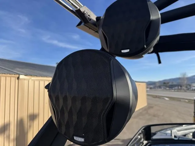 Slide: The Image of 2025 Malibu 25 LSV boat speakers, mounted on a sleek frame, under clear blue skies. - 17