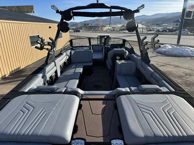 Slide: The Image of 2025 Malibu 25 LSV boat interior with spacious seating and modern design. - 9