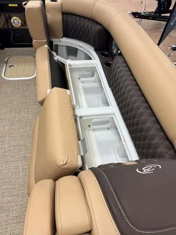 Slide: The Image of 2025 Barletta Lusso L25UC boat interior with tan and brown seating and storage compartments. - 10