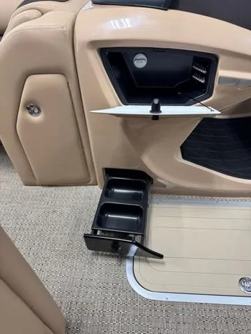 Slide: The Image of 2025 Barletta Lusso L25UC boat interior with storage compartments and beige upholstery. - 12
